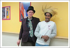 Two guys one in a top hat the other in a straw hat.